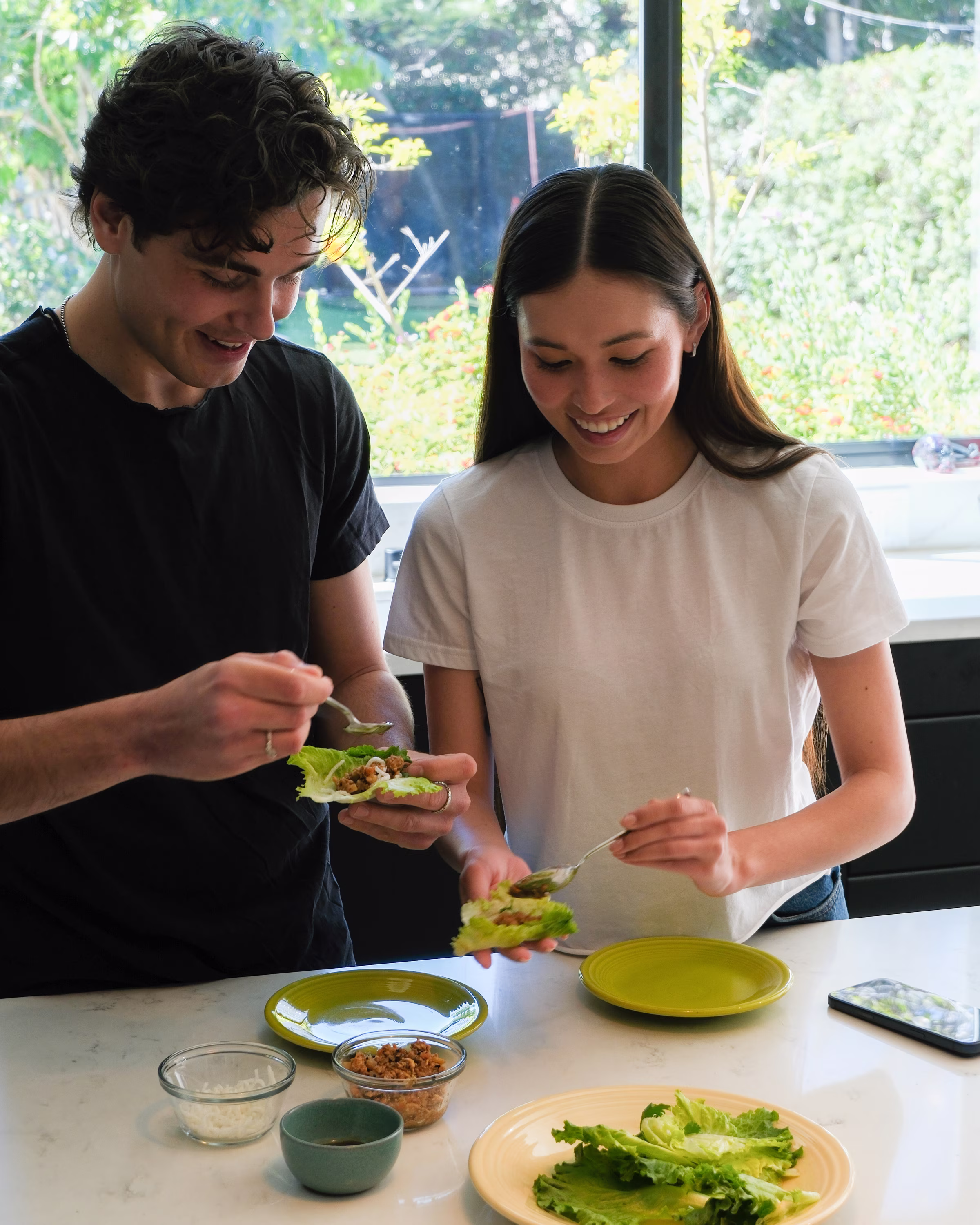Two people preparing a fresh meal together